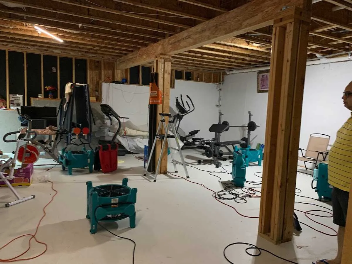 Basement drying equipment setup for Contents Cleaning & Restoration in Burrillville